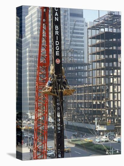 Workers Service Crane Across Street from National Bank Building under Construction on Park Ave-Dmitri Kessel-Premier Image Canvas