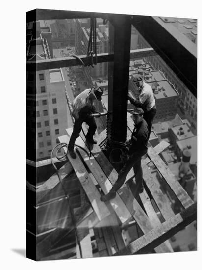 Workmen Attach Steel Beams Above Street During Construction of the Manhattan Company Building-Arthur Gerlach-Premier Image Canvas