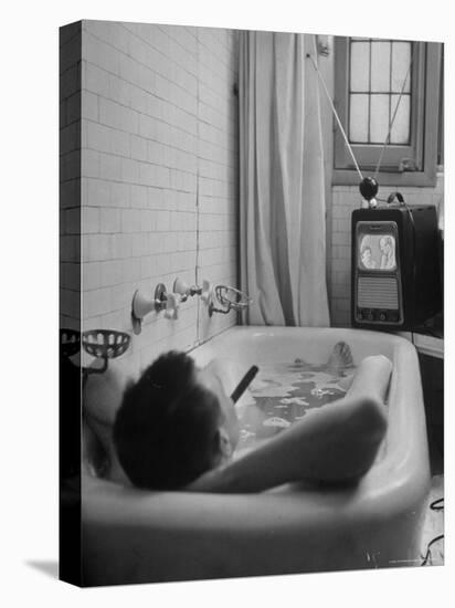 Writer Russell Finch Taking Portable Television Set to Bathroom During His Bath-George Skadding-Premier Image Canvas