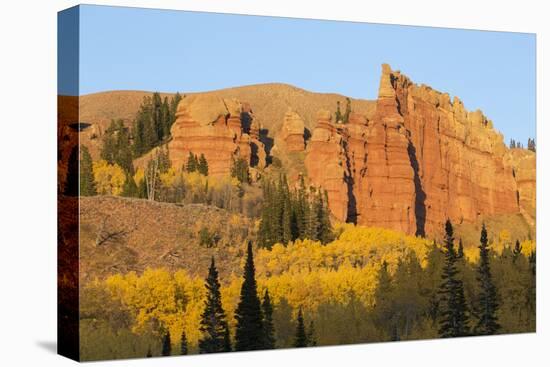 Wyoming, Sublette County. Wyoming Range, colorful autumn aspens are surrounding the Red Cliffs-Elizabeth Boehm-Premier Image Canvas