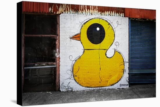 Yellow Duck on Brick Wall in Brooklyn NY-null-Stretched Canvas