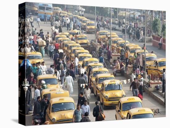 Yellow Kolkata Taxis and Commuters at Howrah Railway Station, Howrah, Kolkata (Calcutta), India-Annie Owen-Premier Image Canvas