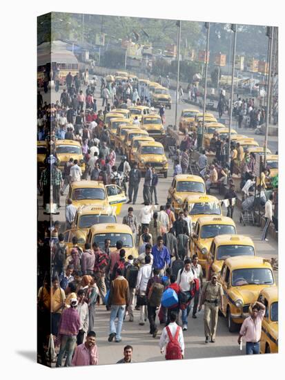 Yellow Kolkata Taxis and Commuters at Howrah Railway Station, Howrah, Kolkata (Calcutta), India-Annie Owen-Premier Image Canvas