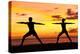 Yoga People Training and Meditating in Warrior Pose Outside by Beach at Sunrise or Sunset-Maridav-Premier Image Canvas