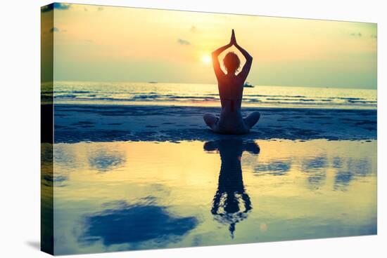 Yoga Woman Sitting In Lotus Pose On The Beach During Sunset-De Visu-Stretched Canvas