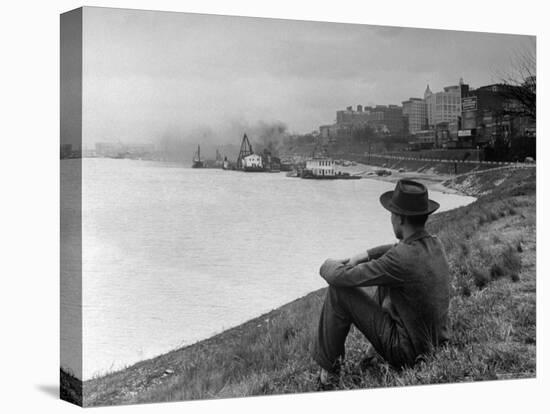 Young African American Boy Sitting on Memphis Riverbank Watching Boats on the Mississippi River-Ed Clark-Premier Image Canvas