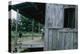 Young Boy on the Porch and a Second Boy Looking Out of Window, on Edisto Island, South Carolina-Walter Sanders-Premier Image Canvas