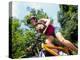 Young Female Recreational Mountain Biker Riding in the Forest-null-Premier Image Canvas