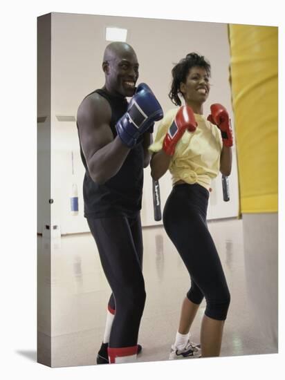 Young Male Coach Coaching a Female Boxer-null-Premier Image Canvas