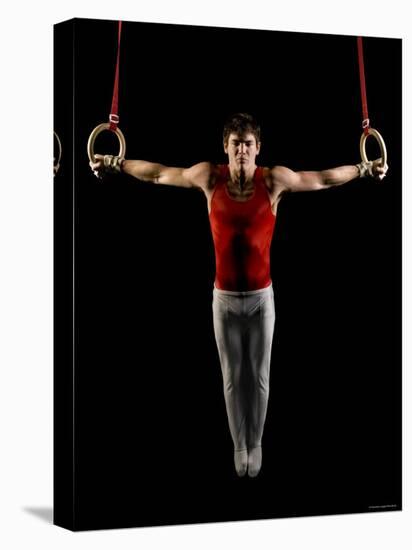 Young Man Exercising on Gymnastic Rings, Bainbridge Island, Washington State, USA-null-Premier Image Canvas