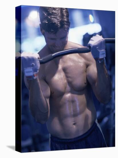 Young Man Exercising with Barbells-null-Premier Image Canvas