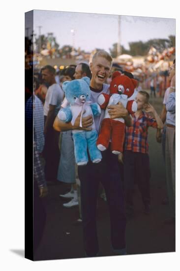 Young Man Holding Stuffed Bears Prizes at a Carnival Game at the Iowa State Fair, 1955-John Dominis-Premier Image Canvas
