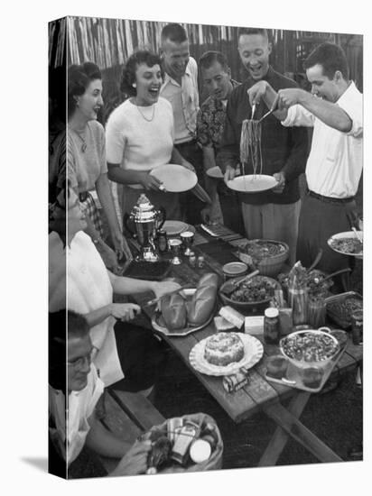 Young Married Couples Enjoying a Backyard Buffet Feast , Featuring Spaghetti-Nina Leen-Premier Image Canvas