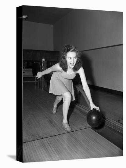 Young Woman Bowling-Philip Gendreau-Premier Image Canvas