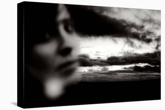 Young Woman Out of Focus in Front of Cloudy Sky Looking into the Camera-Torsten Richter-Premier Image Canvas