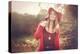 Young Woman Outdoors Wearing a Red Hat-Sabine Rosch-Premier Image Canvas