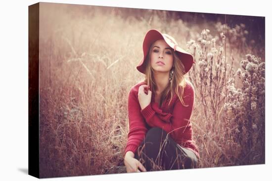 Young Woman Outdoors Wearing a Red Hat-Sabine Rosch-Premier Image Canvas