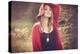 Young Woman Outdoors Wearing a Red Hat-Sabine Rosch-Premier Image Canvas