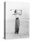 Young Woman Playing Golf at the Beach-null-Stretched Canvas