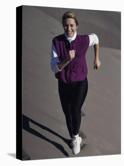 Young Woman Running Up a Sand Dune-null-Premier Image Canvas