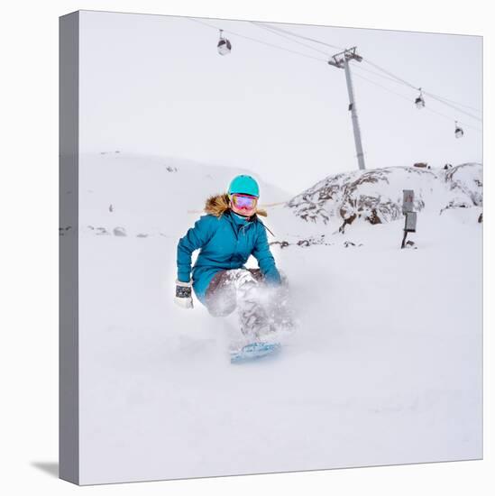Young Woman Snowboarder in Motion on Snowboard in Mountains-Maxim Blinkov-Stretched Canvas