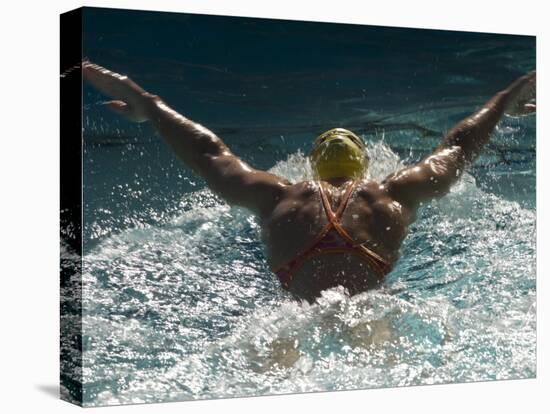 Young Woman Swimming the Butterfly Stroke in a Swimming Pool, Bainbridge Island, Washington, USA-null-Premier Image Canvas