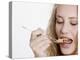 Young Womand Eating Cornflakes from a Spoon-null-Premier Image Canvas
