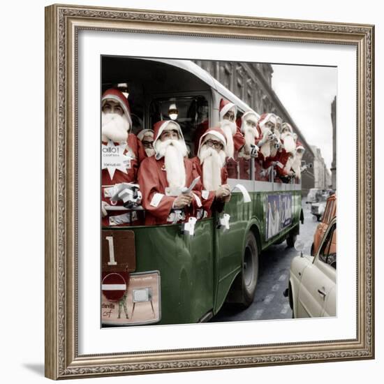 100 Santa Claus in a Special Bus in Paris December, 19, 1966. Colorized Document-null-Framed Photo