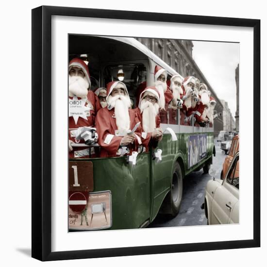 100 Santa Claus in a Special Bus in Paris December, 19, 1966. Colorized Document-null-Framed Photo