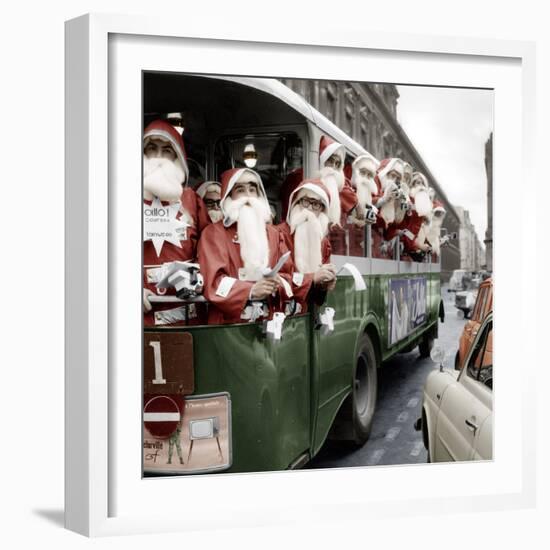 100 Santa Claus in a Special Bus in Paris December, 19, 1966. Colorized Document-null-Framed Photo