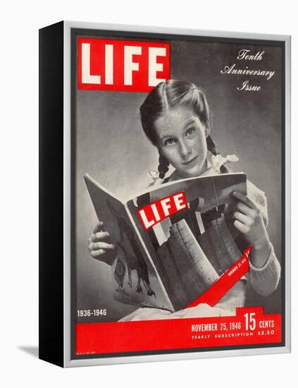 10th Anniversary Features Young Girl Reading First Issue of LIFE, November 25, 1946-Herbert Gehr-Framed Premier Image Canvas