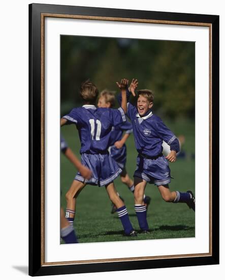 11 Year Old Boys Soccer Player Celebates a Goal-null-Framed Photographic Print