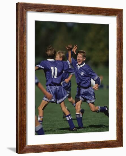 11 Year Old Boys Soccer Player Celebates a Goal-null-Framed Photographic Print