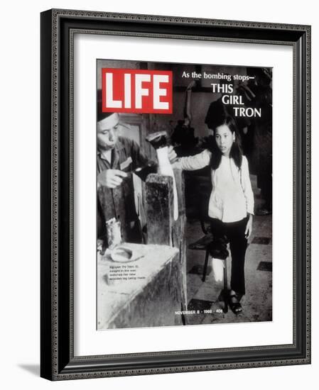 12-Year-Old Vietnamese Girl Nguyen Thi Tron Watching New Wooden Leg Being Made, November 8, 1968-Larry Burrows-Framed Photographic Print