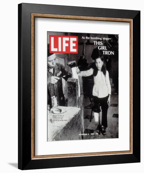 12-Year-Old Vietnamese Girl Nguyen Thi Tron Watching New Wooden Leg Being Made, November 8, 1968-Larry Burrows-Framed Photographic Print