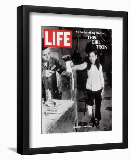 12-Year-Old Vietnamese Girl Nguyen Thi Tron Watching New Wooden Leg Being Made, November 8, 1968-Larry Burrows-Framed Photographic Print