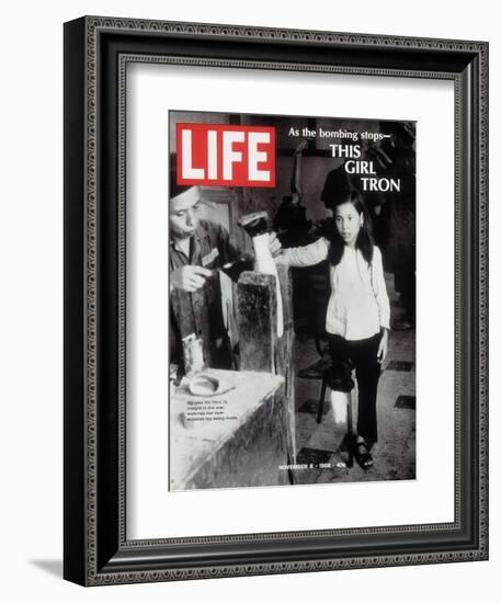 12-Year-Old Vietnamese Girl Nguyen Thi Tron Watching New Wooden Leg Being Made, November 8, 1968-Larry Burrows-Framed Photographic Print