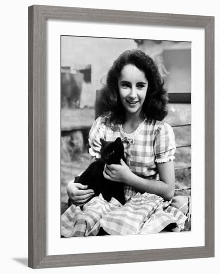 13 Year Old Actress Elizabeth Taylor Outside, Holding One of Her Many Pets, a Black Cat Named Jill-Peter Stackpole-Framed Premium Photographic Print