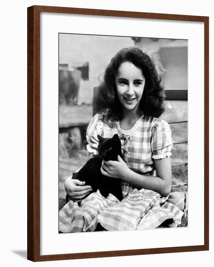 13 Year Old Actress Elizabeth Taylor Outside, Holding One of Her Many Pets, a Black Cat Named Jill-Peter Stackpole-Framed Premium Photographic Print