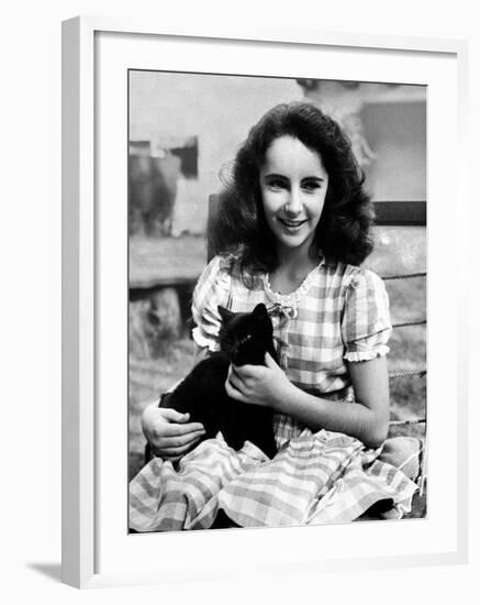 13 Year Old Actress Elizabeth Taylor Outside, Holding One of Her Many Pets, a Black Cat Named Jill-Peter Stackpole-Framed Premium Photographic Print