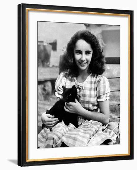 13 Year Old Actress Elizabeth Taylor Outside, Holding One of Her Many Pets, a Black Cat Named Jill-Peter Stackpole-Framed Premium Photographic Print