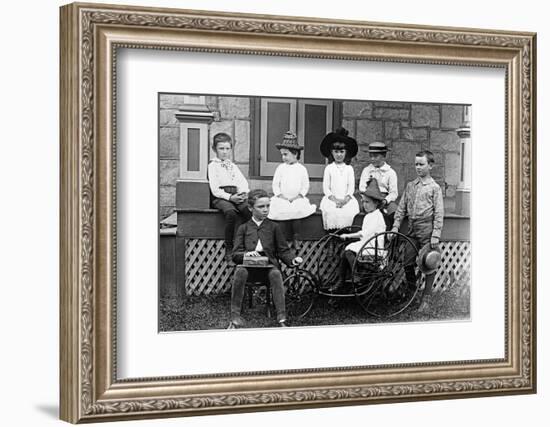 1890s 1900s TURN OF THE CENTURY GROUP OF SEVEN CHILDREN SITTING ON & AROUND PORCH ONE GIRL ON OL...-H. Armstrong Roberts-Framed Photographic Print