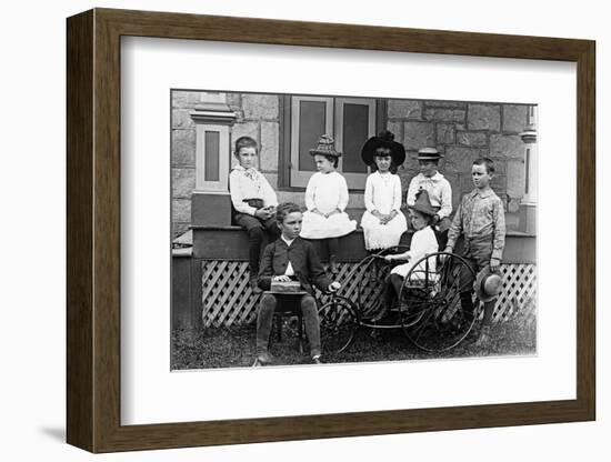 1890s 1900s TURN OF THE CENTURY GROUP OF SEVEN CHILDREN SITTING ON & AROUND PORCH ONE GIRL ON OL...-H. Armstrong Roberts-Framed Photographic Print