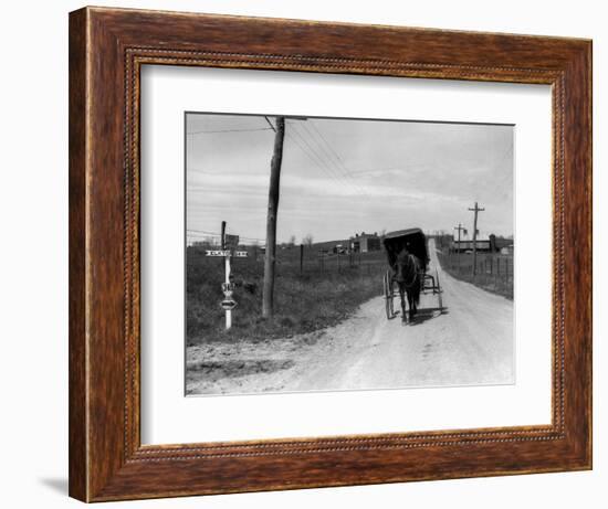 1920s-1930s Amish Man Driving Buggy Down Rural Dirt Road in Farm Country-null-Framed Photographic Print