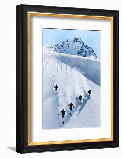 1920s 1930s FIVE ANONYMOUS MEN SKIING DOWN SNOW COVERED ALPS SWITZERLAND-H. Armstrong Roberts-Framed Photographic Print