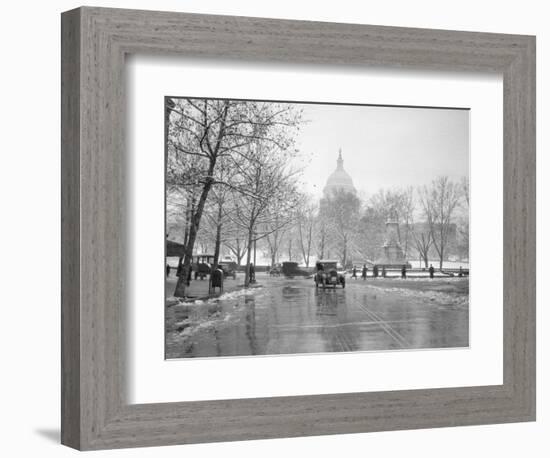 1920s-1930s the Capitol Building and Old Car Traffic in Winter Washington DC-null-Framed Photographic Print