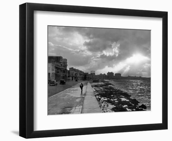 1930s-1940s Anonymous Silhouetted Man Walking Along Havana Sea Wall at Sunset Cuba-null-Framed Photographic Print