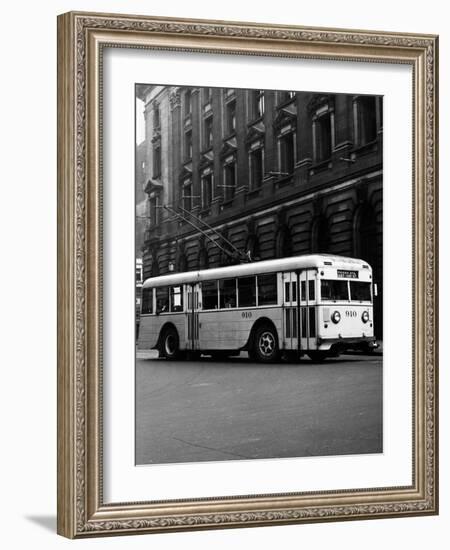 1930s-1940s Public Transportation Trackless Trolley Electric Bus About to Round Street Corner-null-Framed Photographic Print