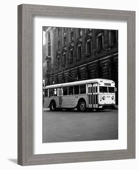 1930s-1940s Public Transportation Trackless Trolley Electric Bus About to Round Street Corner-null-Framed Photographic Print