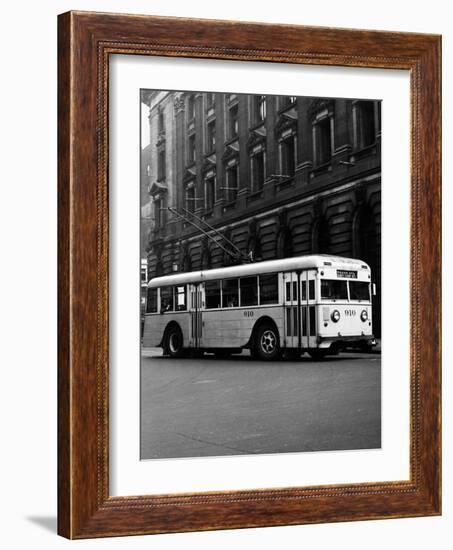 1930s-1940s Public Transportation Trackless Trolley Electric Bus About to Round Street Corner-null-Framed Photographic Print